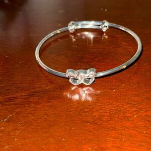 This bracelet is an adjustable bangle bracelet made is stainless steel.